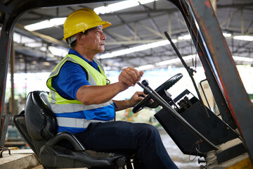 senior worker driving forklift in the factory