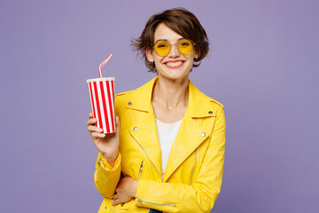 Young smiling woman she wear yellow shirt white t-shirt casual clothes glasses hold in hand cup of...