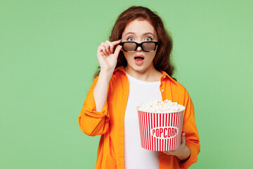 Young shocked ginger woman she wearing orange shirt white t-shirt casual clothes lower 3d glasses...