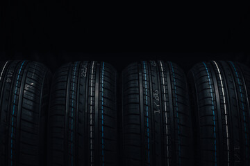 Car tires on a black background.