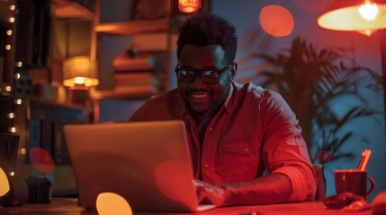 Man Working on Laptop at Night