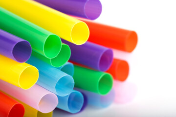 Colorful plastic drinking straws on white background. Close up.