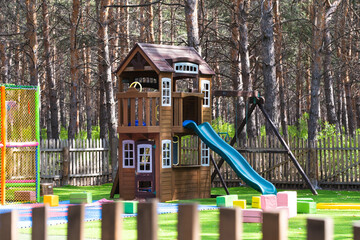 Children playground in the park in the summer in the open air.
