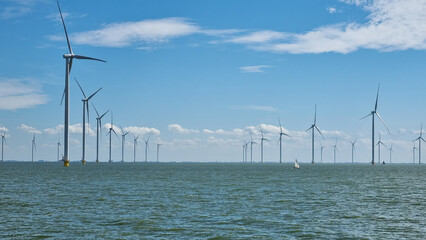 Large body of water with windmills in background