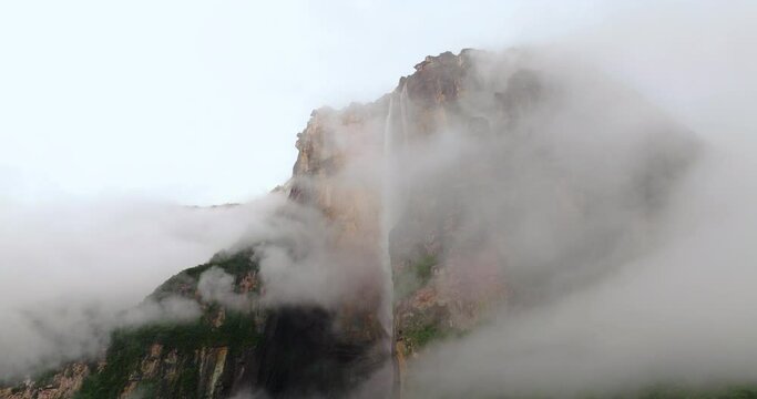 Morning Clouds Reveal Angel Falls Over Steep Mountains In Bolivar State, Southeastern Venezuela. Aerial Shot