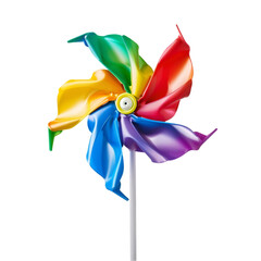 Spinning colourful pinwheel isolated on white background, representing energetic playfulness 