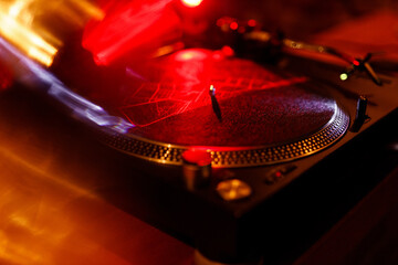 Vinyl records as part of history and a revived musical tradition today. Vinyl in a cafe, playing in...