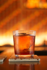 Sophisticated whiskey on the rocks, showcasing amber hues and ice cubes, perfect for elegant bars, celebrations, or relaxing evenings.