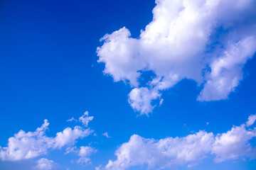 Clouds against the blue sky close-up. Changes in weather during the rainy season. Thunderclouds,...