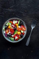 Greek salad. Fresh tomato, cucumber, bell pepper, Feta cheese, onion, and olives. Healthy summer...