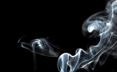Art swirl of smoke on black background.