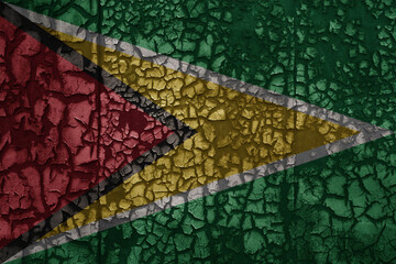 flag of guyana on a old grunge metal rusty cracked wall background