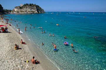 Obraz premium Sea beach with turquoise water and sand where people relax