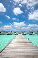 luxury hotel resort in Maldives, wooden pier over turquoise water beach, paradise holiday destination