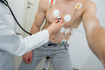 Medical professional conducting a cardiovascular evaluation with ecg electrodes