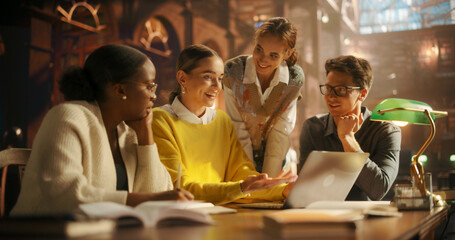 Diverse Group of Students Collaborating on a Project in a Warmly Lit Library. Young Adults Engaged in Discussion, Using Laptop for E-Learning, Surrounded by Bookshelves with Academic Books