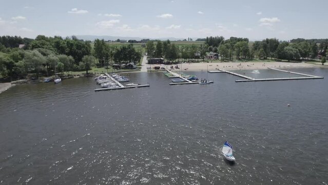 rial drone view of a lake marina with boats and water infrastructure. Concept of recreation, water transport, tourism and leisure activities. Ideal for travel marketing, tourism promotion