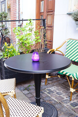 city ​​landscape. street cafe on a city street. table, chair and flower pot
