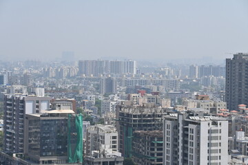 Fototapeta premium View of Pune in summer, Cityscape Skyline, buildings holdings, Signboards, and banners, Pune, Maharashtra, India
