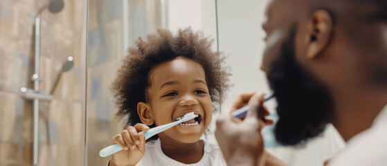 Joyful child learns to brush teeth with guidance from a loving father.