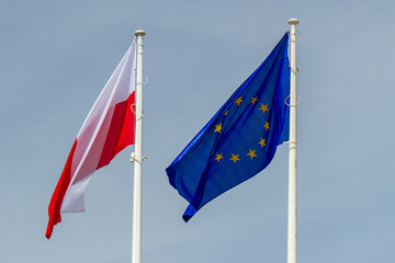 Poland and UE European Union flags against the sky