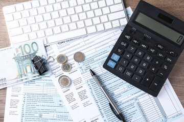 Tax accounting. Flat lay composition with calculator and documents on wooden table