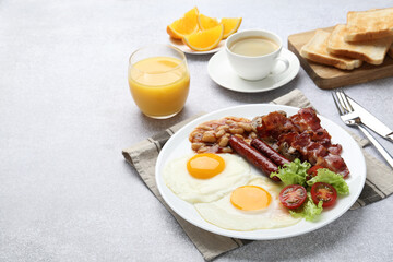Delicious breakfast with sunny side up eggs on light table. Space for text