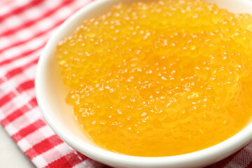 Fresh pike caviar in bowl on table, closeup