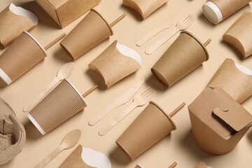 Eco friendly food packaging. Paper containers and wooden cutlery on beige background