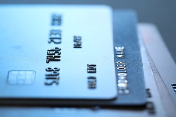 Many credit cards on gray background, macro view