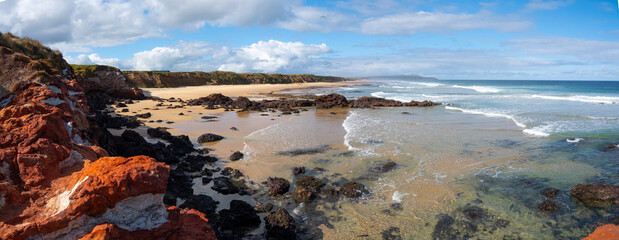 Beautiful panoramic scenery and ocean view over the red rock cliffs of the coastline of Woolamai Surf Beach on Phillip Island. VIC Australia.