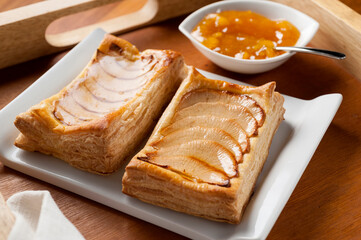 two apple tarts in puff pastry with jam