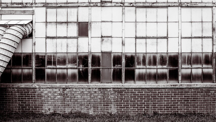 Ventialtion enters old factory building in monochrome