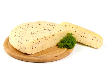 Piece of fresh Cheese with Cumin Seeds, close-up, isolated on white background.