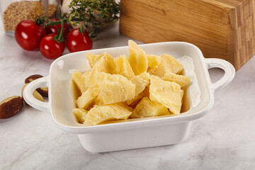 Crushed parmesan cheese in the bowl