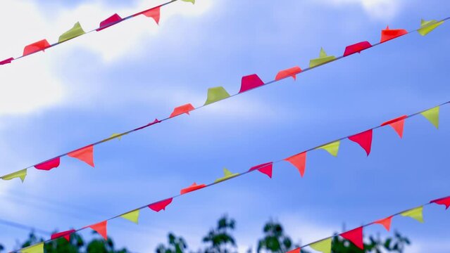 Experience a mesmerizing display as a variety of flags flutter gracefully in the air, creating a beautiful and dynamic visual spectacle.