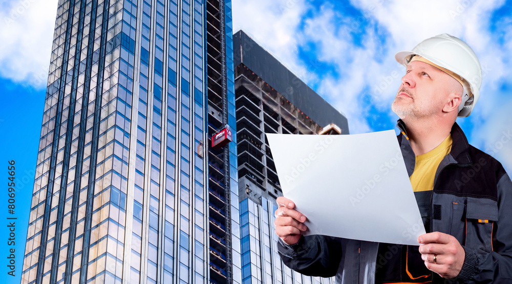 Poster man builder. guy architect. engineer stands near skyscraper. architect inspects building under const