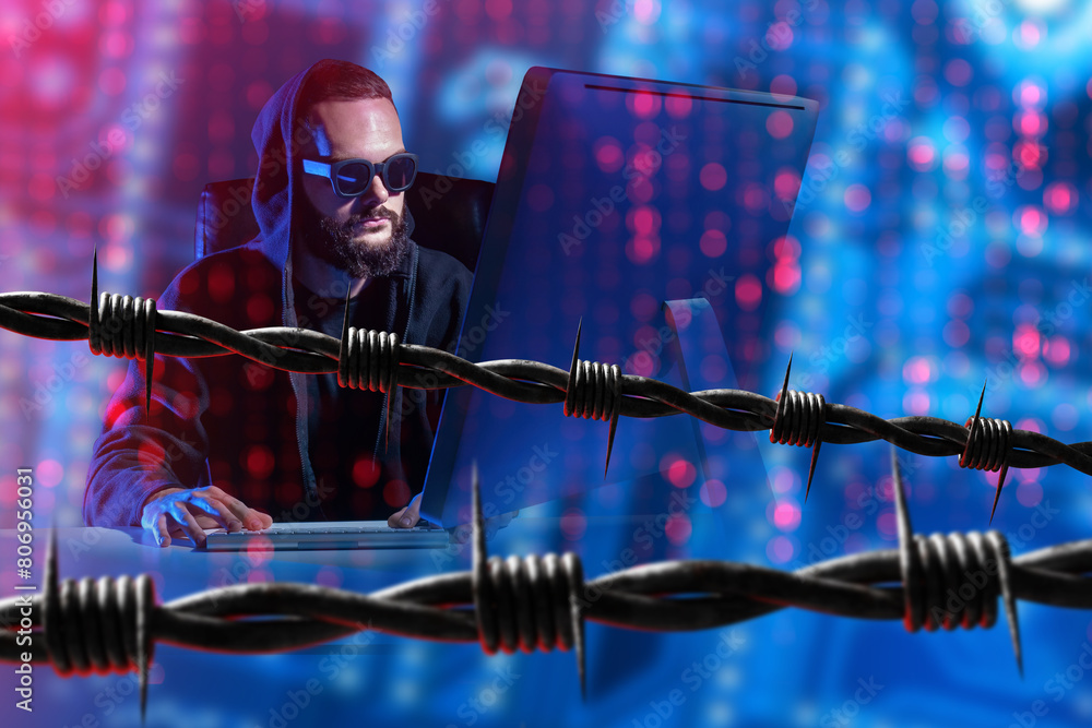 Poster man hacker. cyber criminal. hooded hacker using computer. barbed wire near digital scammer. hacker p