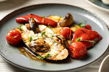Close-up of grilled vegetables on a blue plate. keto diet and healthy eating concept