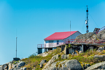 A lighthous service structure on rocky coast of Pacific ocean in Vancouver, BC