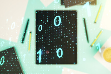 Creative abstract binary code sketch and modern digital tablet on background, hacking and matrix concept. Multiexposure