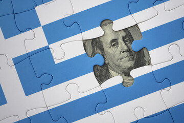 puzzle with the national flag of greece and usa dollar banknote. finance concept