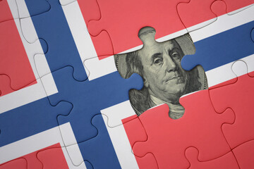 puzzle with the national flag of norway and usa dollar banknote. finance concept