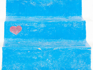 Blue painting vintage steps of ladder with red heart