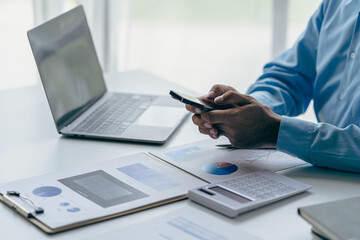 Businessman analyzing company financial report, balance sheet, working with document graphs Save photos for the stock market, office, taxes, close-up photos.