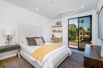 the spacious bedroom has its own outdoor patio view with access