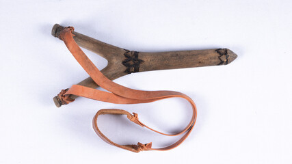 A slingshot or catapult is a small hand powered projectile weapon