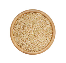 top view flat lay dry brown short grain rice isolated on white background in wood bowl