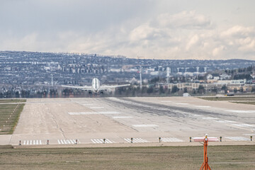 Airplane Jetliner departing at airport runway