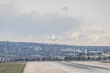 Airplane Jetliner departing at airport runway